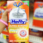 A Person Holding a 40 Count Box of Hefty Ultra Strong Tall Kitchen Trash Bags