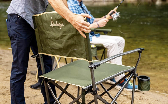 A Person Holding a Slumberjack Lone Mesa Quad Folding Directors Chair