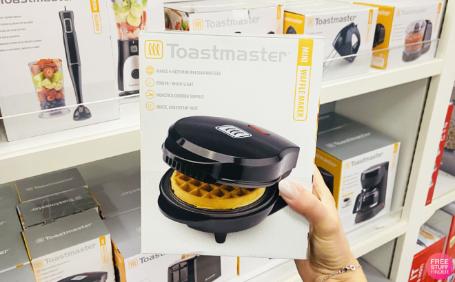 A Person Holding a Toastmaster Mini Waffle Maker