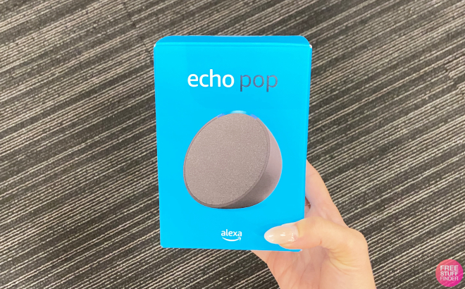 A Person Holding an Amazon Echo Pop Speaker