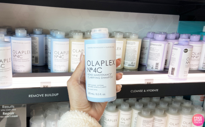 A Person Holding an Olaplex No 4C Bond Maintenance Clarifying Shampoo