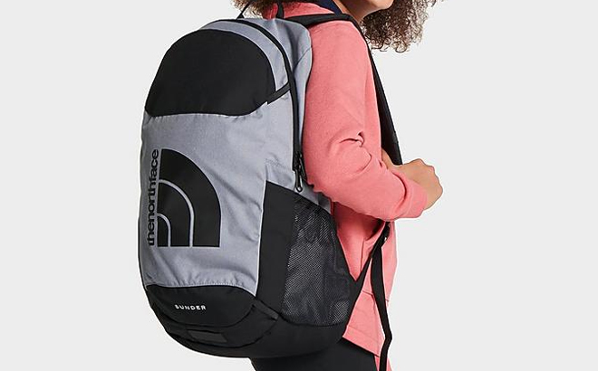 A Person Holding the The North Face Sunder Backpack in Gray