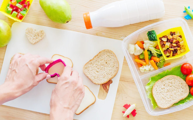 A Person Preparing Lunchbox Snacks