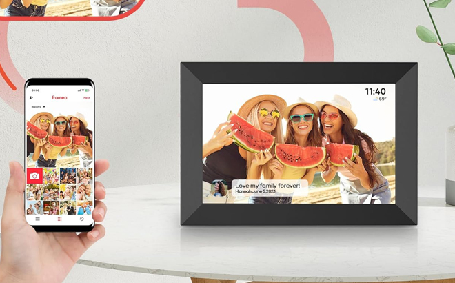 A Person Sending Pictures to a Digital Picture Frame Using a Phone