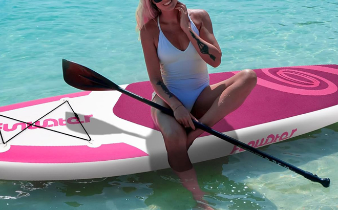 A Person Sitting on a FunWater Paddle Board