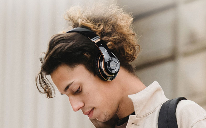 A Person Using Falebare Over Ear Wireless Headphones