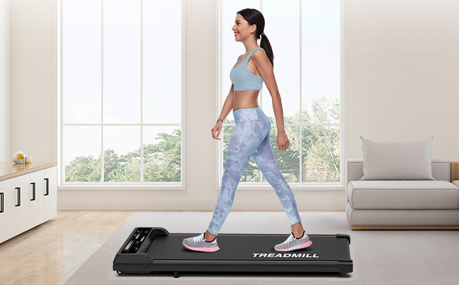 A Person Using Walking Pad Treadmill