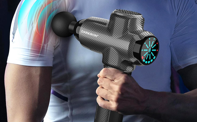 A Person Using a Deep Tissue Massage Gun