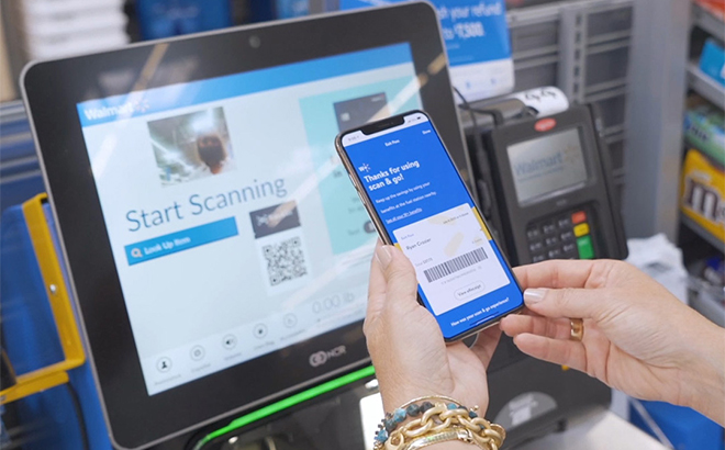 A Person Using the Walmart Plus App at a Gas Station