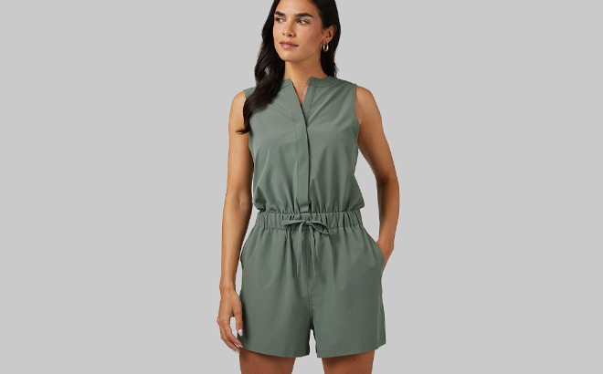 A Person Wearing 32 Degrees Womens Flyweight Woven Romper in Castor Grey Color