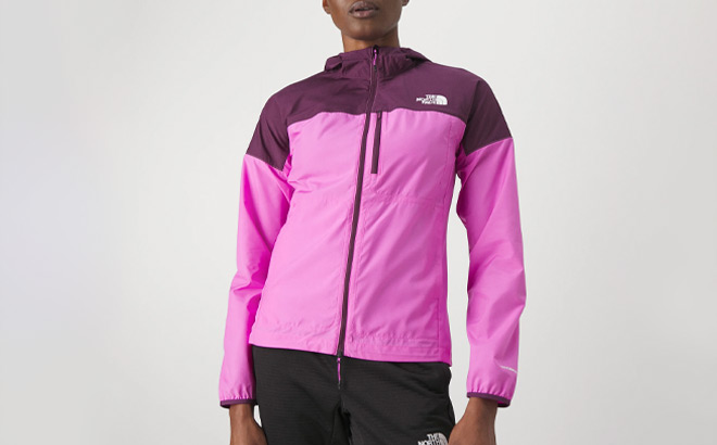 A Person Wearing The North Face Higher Run Wind Jacket in Violet Crocus Color