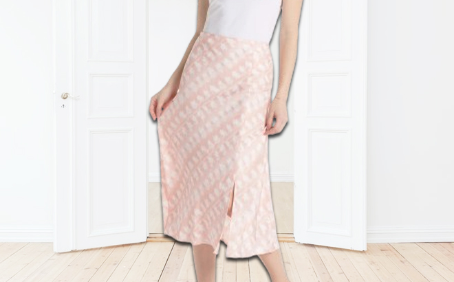 A Person Wearing Time and Tru Womens Satin Midi Slip Skirt