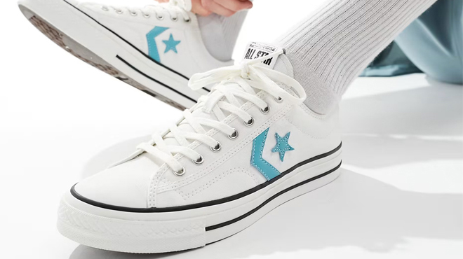 A Person Wearing a Pair of Converse Star Player 76 Shoes