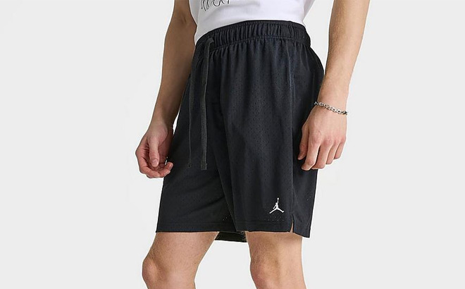 A Person is Wearing Nike Mens Jordan Dri Fit Sport Mesh Shorts