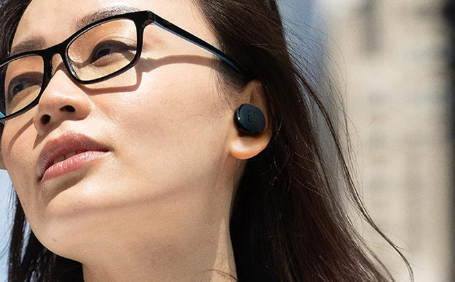 A Person wearing JBL Noise Cancelling Wireless Earbuds