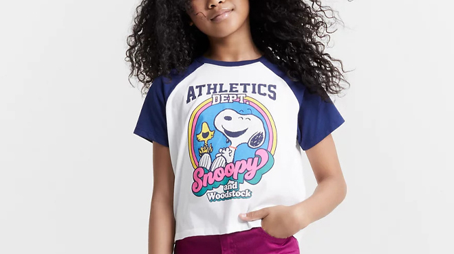 A Person wearing an Epic Threads Snoopy Girls Graphic T Shirt