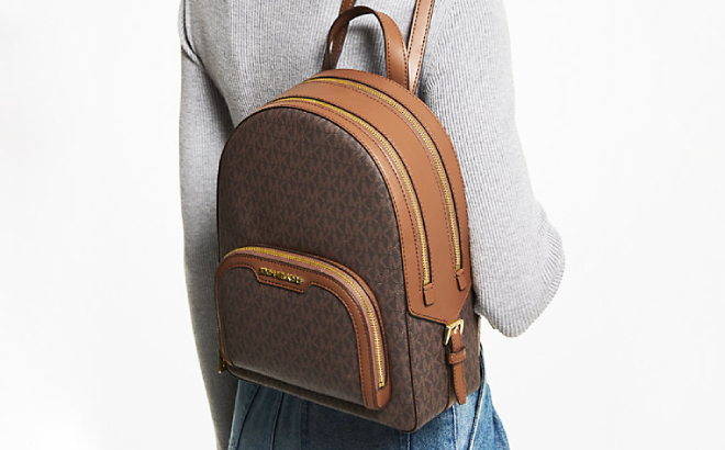 A Person with a Michael Kors Jaycee Medium Logo Backpack