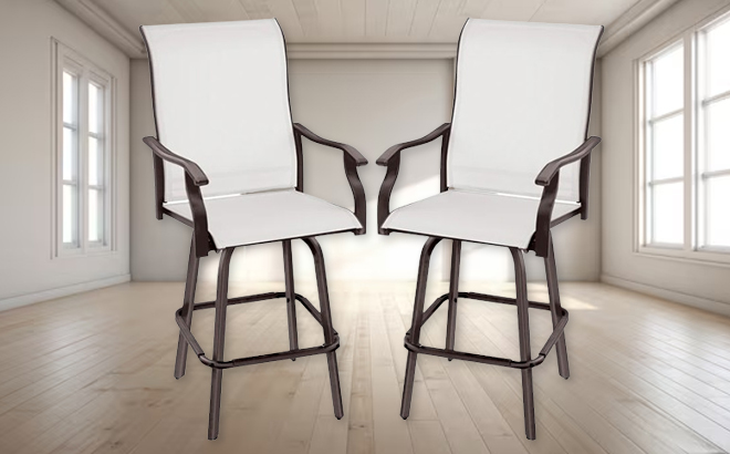 A Set of Two Swivel Barstools with 360 Rotation in a Empty Room