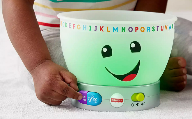 A Toddler Playing with Fisher Price Magic Color Mixing Bowl