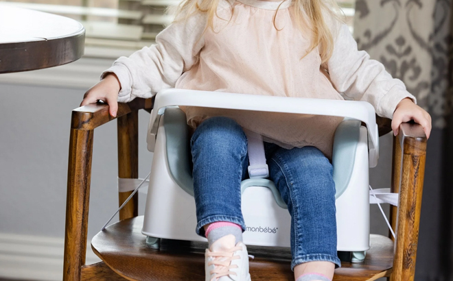 A Toddler Seating on a Monbebe Bobbi Feeding Booster Seat