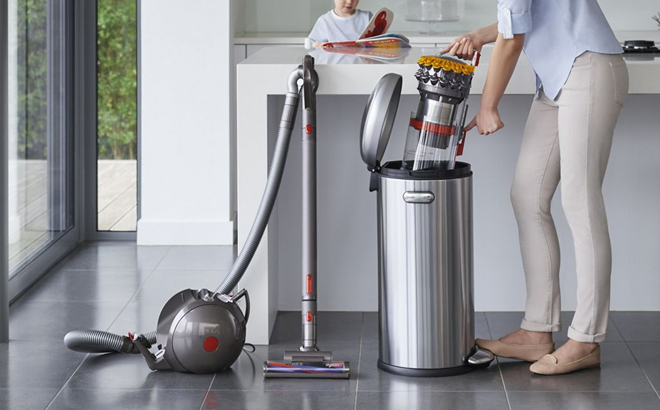 A Woman Cleaning the Canister of the Dyson Big Ball Turbinehead Vacuum