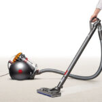 A Woman Cleaning with the Dyson Big Ball Turbinehead Canister Vacuum