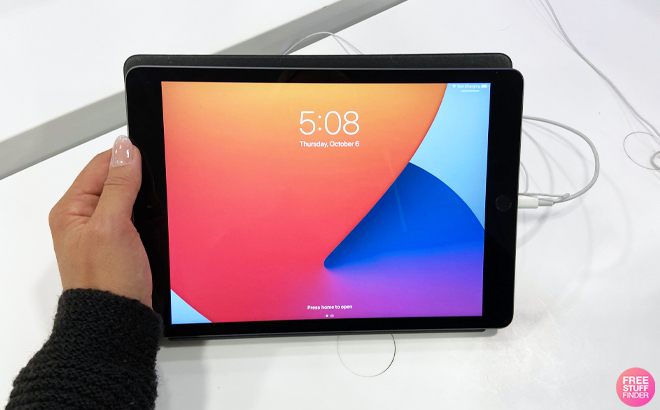 A Woman Holding Apple 10.2-Inch iPad