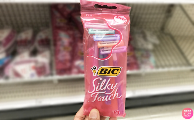 A Woman Holding BIC Silky Touch Disposable Razors