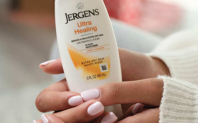 A Woman Holding Jergens Ultra Healing Dry Skin Moisturizer