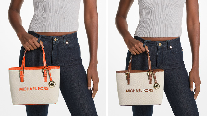 A Woman Holding Michael Kors Jet Set Travel Extra Small Canvas Top Zip Tote Bags