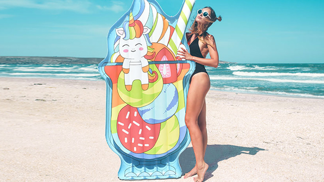 A Woman Standing Beside Ice Cream Inflatable Pool Float