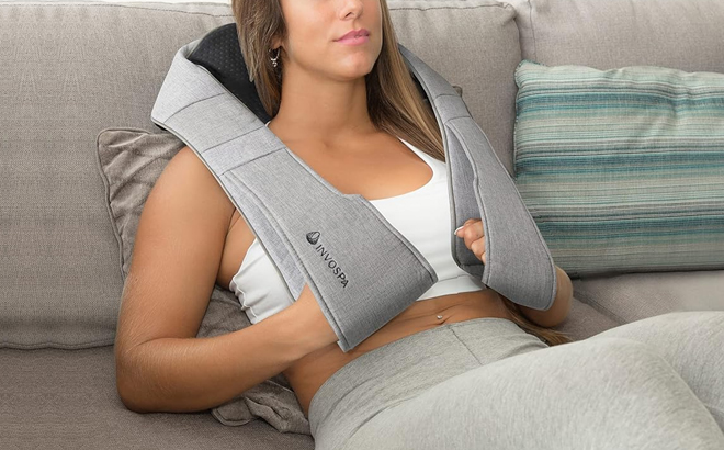 A Woman Using the InvoSpa Shiatsu Full Body Massager with Heat