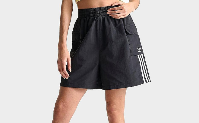 A Woman Wearing Adidas Originals Adicolor Cargo Lifestyle Shorts