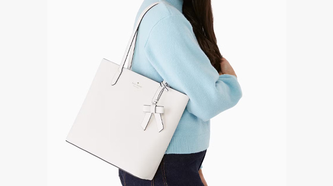 A Woman Wearing Kate Spade Outlet Brynn Tote Bag