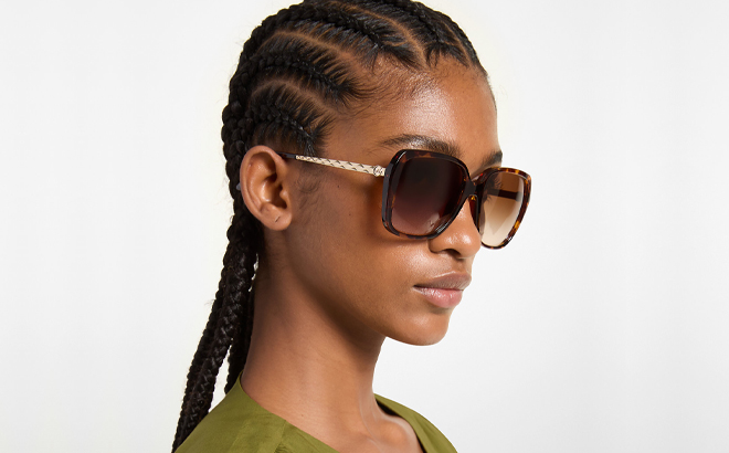 A Woman Wearing Michael Kors Albany Sunglasses