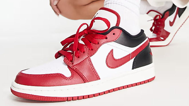 A Woman Wearing Nike Air Jordan 1 Low Sneakers