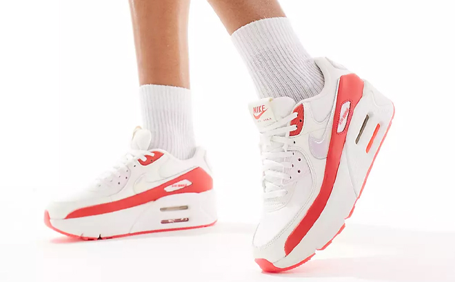 A Woman Wearing Nike Air Max 90 LV8 Sneakers