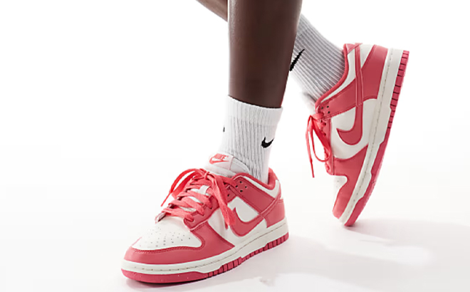 A Woman Wearing Nike Dunk Low Sneakers in Pink