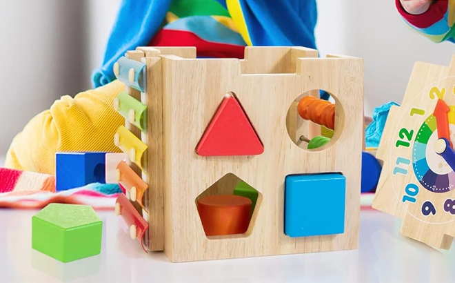 Children Playing with the Bravmate Wooden Activity Cube