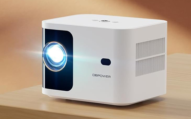 Dbpower Mini Bluetooth Projector with WiFi on a Table