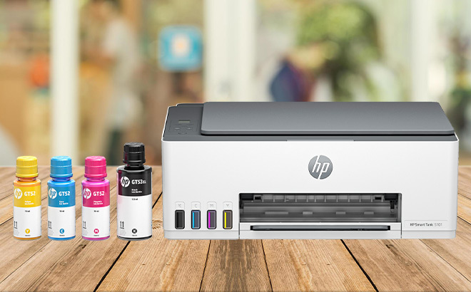 HP Printer next to Colorful Ink Bottles