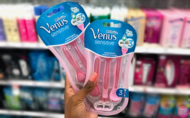 Hand holding Gillette Venus Sensitive Disposable Razor