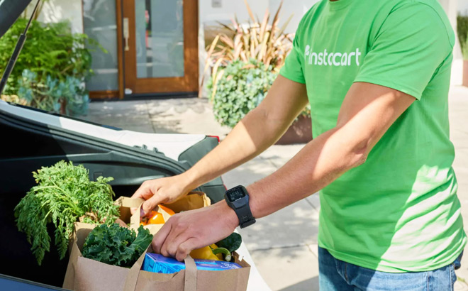 Instacart Shopper Taking Groceries from a Car Trunk