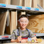 Kid at the Lowes Harvest Hayride Workshop