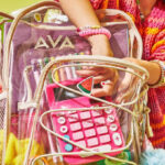 Little Girl Taking School Supplies Out of Her Backpack