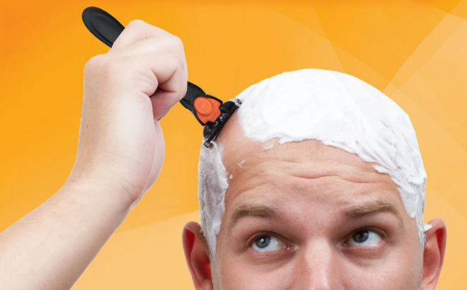 Man shaving head with BIC Comfort 3