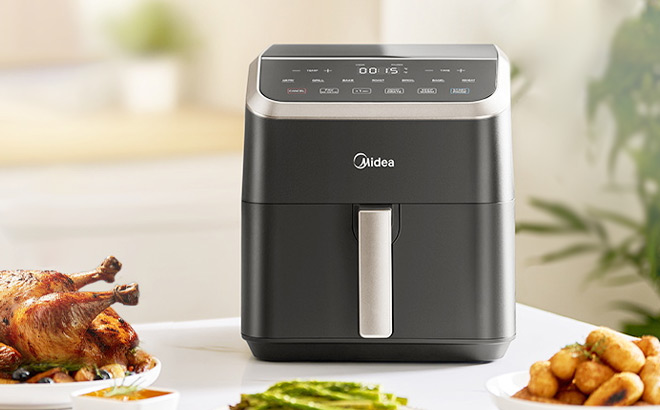 Midea 5 5 Quart HeatXpress 9 in 1 Air Fryer on the Table