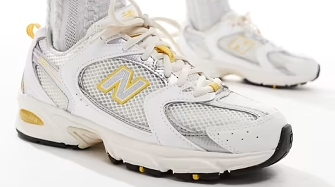 New Balance 530 sneakers in white with yellow and gray details