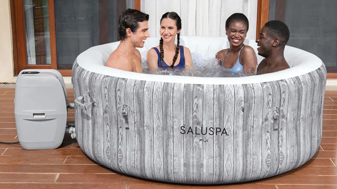 People Dipping on a Bestway AirJet Inflatable Hot Tub