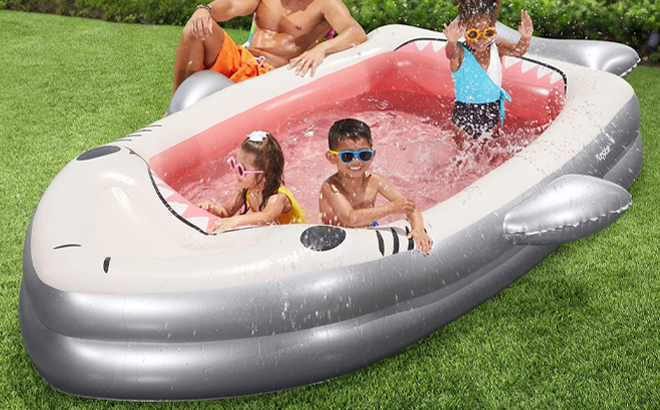 People playing in Funsicle 10 Feet Big Jaws Inflatable Pool